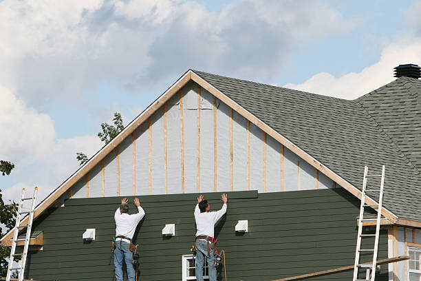 Professional Storm Damage Siding Repair technician working in The Plains, OH